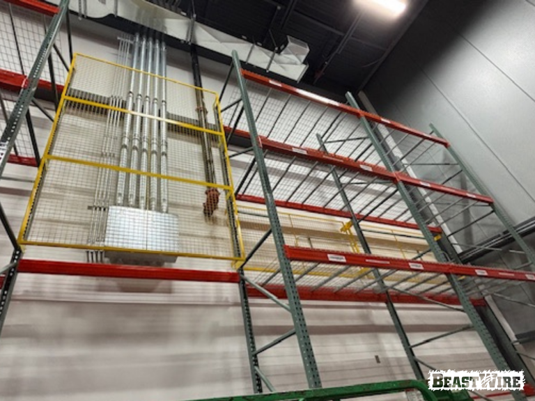 BeastWire® Pallet Rack Backing panels installed to shield exposed utilities.
