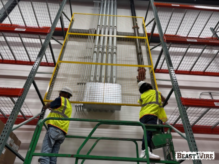 BeastWire® Pallet Rack Backing panels installed to shield exposed utilities.