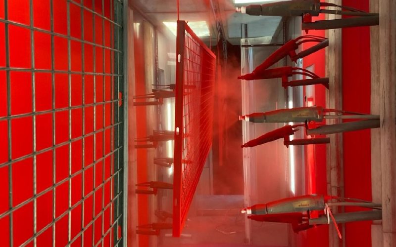 SpaceGuard Finishing Solutions - Powder Coating Line - Red Spray Guns on Mesh