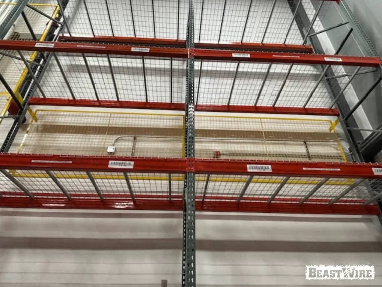 BeastWire® Pallet Rack Backing panels installed to shield exposed utilities.